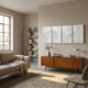 Harmonic Forms 4-Panel White Wood Carving 3D Wall Art mounted above a teak sideboard in a neutral living room with a linen sofa and bookshelf.