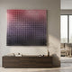 Wavluxe Gradient Pink & Purple Wood Mosaic 3D Wall Art mounted above a dark wood sideboard, with a vase and books below and a sofa to the side.