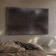 Wavluxe Gradient Grey Wood Mosaic 3D Wall Art by Giant Sculptures mounted above a bed with taupe linen, its pegged grid casting shadows across the wall.