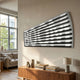 Illustra Minimalist BOOM Text 3D Wooden Wall Art by Giant Sculptures, curved grey slatted panel revealing white lettering, mounted above a wooden sideboard.