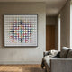 Prismatrix Multicolour Geometric Wood Collage 3D Wall Art by Giant Sculptures displayed above a grey sofa in a modern living room with wood flooring.