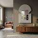 Aurellis Silver Arch & Square Geometric Mirror Frame Wall Art mounted on a grey wall above a walnut sideboard in a modern living room with a terracotta sofa.