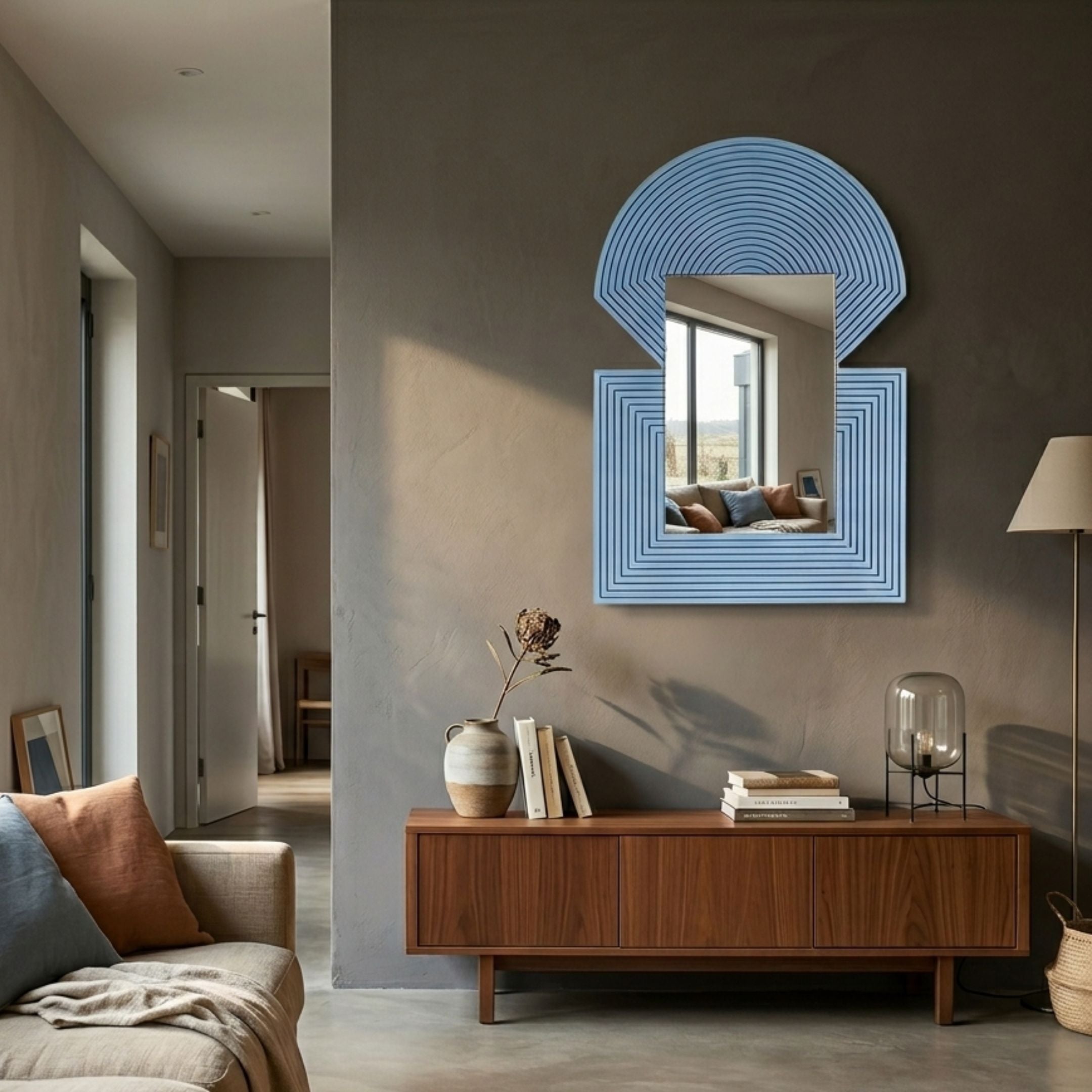 Aurellis Blue Arch & Square Geometric Mirror Frame Wall Art mounted above a walnut sideboard in a modern living room with grey plaster walls.