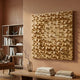 Orbila Wooden Spheres Dynamic 3D Wall Art With Frame by Giant Sculptures mounted on a terracotta wall above a wooden console with books and a bookshelf nearby.