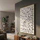 Artiora White Abstract Wooden Shard 3D Wall Art in a gold frame mounted on a dark grey wall in a modern living room above a wooden console.