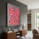 Urbanic Pink Welcome Script 3D Wooden Graffiti Wall Art by Giant Sculptures displayed above a walnut sideboard in a modern living room with grey walls.