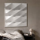 Verto White Stretch Fabric Layered Wooden 3D Wall Art with diagonal ridges mounted above a bed with linen bedding and a mushroom lamp on a nightstand.