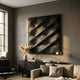 Verto Black Stretch Fabric Layered Wooden 3D Wall Art by Giant Sculptures mounted above a black sideboard in a grey-walled living room with pampas grass.