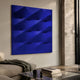 Verto Deep Blue Stretch Fabric Layered Wooden 3D Wall Art with diagonal ridges, mounted in a modern living room above a sofa beside a travertine column.