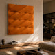 Verto Vibrant Orange Stretch Fabric Layered Wooden 3D Wall Art with diagonal ridges mounted above a low wood console in a sunlit living room.