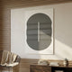 Ellipse Charcoal Oval Wood 3D Canvas Wall Art by Giant Sculptures displayed above a wooden console in a Nordic-inspired room with a wire chair and books.