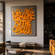 Urbanic Orange Welcome Script 3D Wooden Graffiti Wall Art by Giant Sculptures displayed above a bench in a sunlit modern living room beside bookshelves.