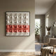 Tessera White & Coral II Geometric Wood 3D Wall Art by Giant Sculptures displayed on a beige hallway wall near a linen armchair and console.