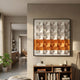 Tessera White & Orange II Geometric Wood 3D Wall Art by Giant Sculptures, framed in black above a wooden bookshelf in a sunlit modern living room.