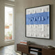 Tessera White & Blue I Geometric Wood 3D Wall Art by Giant Sculptures displayed above a walnut console in a neutral room beside a window with potted plants.