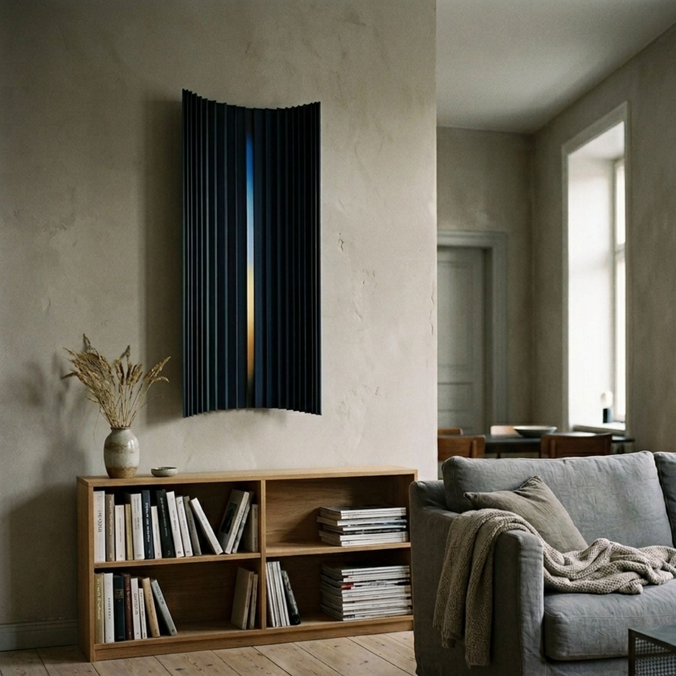 Illumina Blue Vertical Gradient Wooden Hand-Painted 3D Wall Art by Giant Sculptures mounted above an oak bookshelf in a minimalist living room.