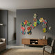 Spectra II Multicoloured Interwoven Hexagonal Frame 3D Wall Art by Giant Sculptures displayed on a grey living room wall above a wooden console with floor lamps.