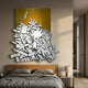 Assemblia Yellow Hand-Painted Wood Graffiti Wall Art by Giant Sculptures mounted above a wooden bed with grey linens in a modern bedroom.