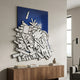 Assemblia Blue Hand-Painted Wood Graffiti Wall Art by Giant Sculptures displayed above a walnut sideboard with books and a vase in a modern living room.