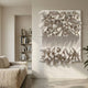 Forme IV Cream Wood Cluster Abstract 3D Wall Art by Giant Sculptures mounted in a wabi-sabi living room with a linen sofa and bookshelf nearby.