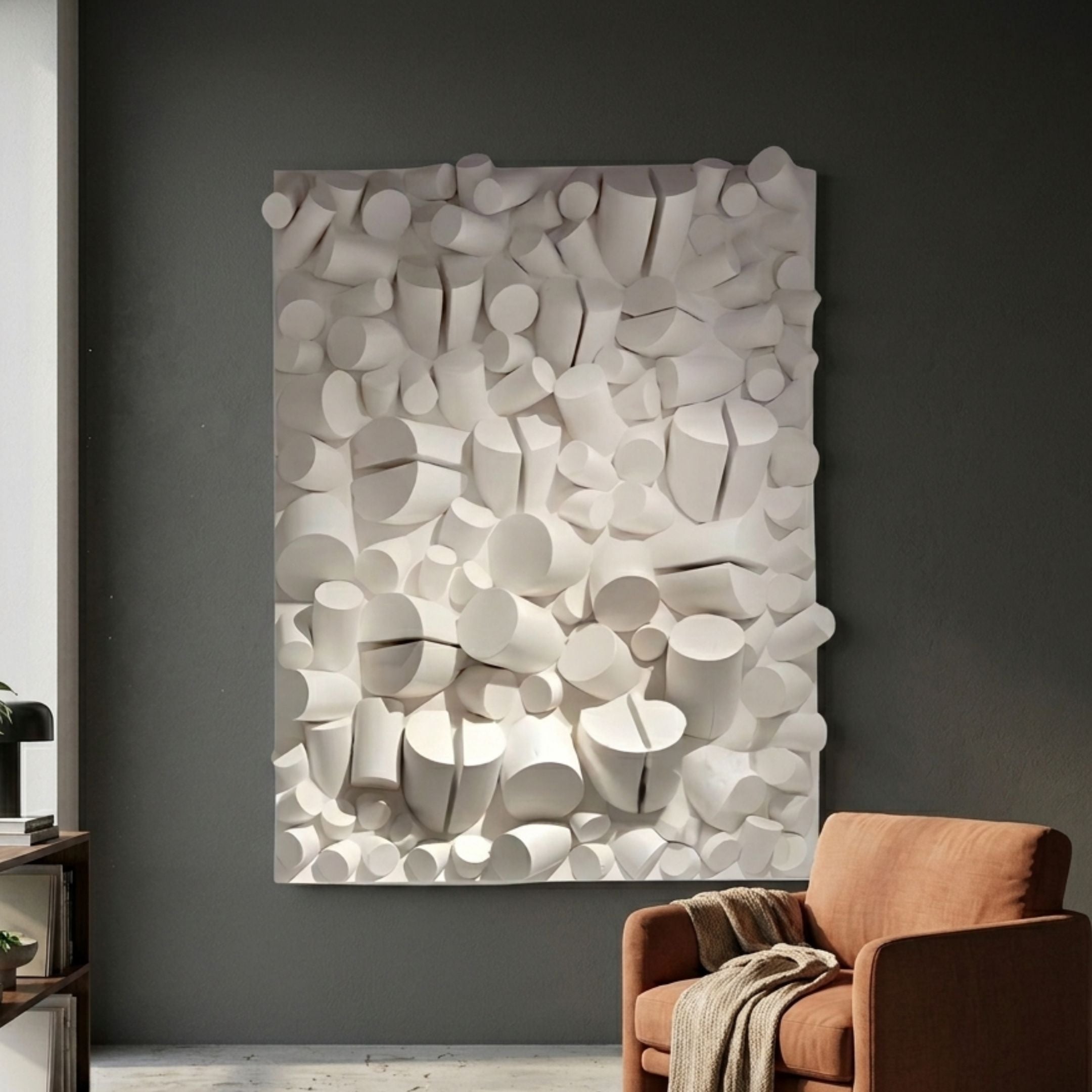 Forme II Cream Wood Cluster Abstract 3D Wall Art by Giant Sculptures mounted on a dark grey living room wall above a tan armchair with throw.