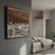 Terracova Warm Ochre Earthy Layers Cardboard Square 3D Wall Art by Giant Sculptures, displayed on a grey bedroom wall above a linen-dressed bed.