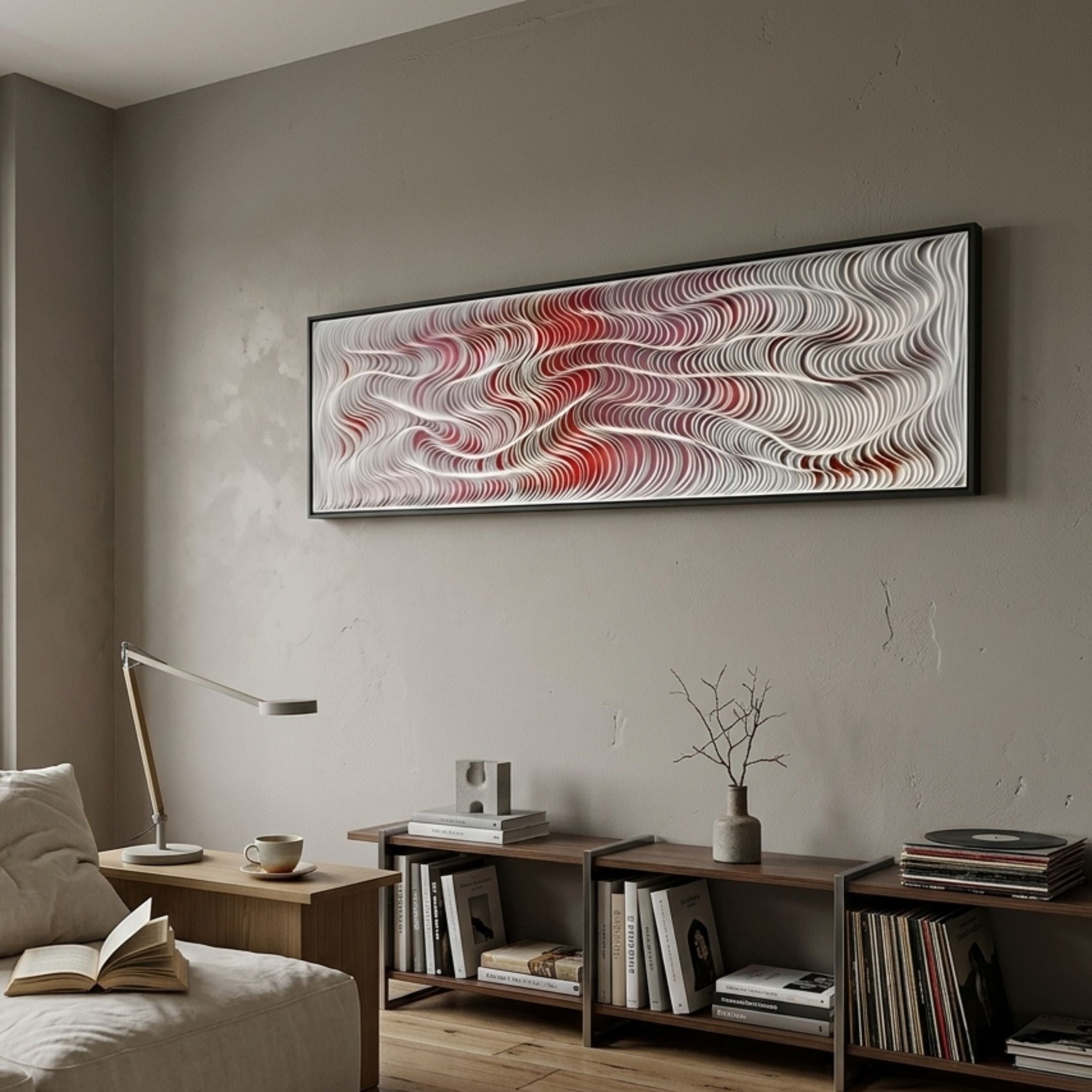 Fluenta Scarlet Red Ripple Linear Cardboard 3D Wall Art by Giant Sculptures mounted horizontally above a wooden console with books, lamp, and vase in a modern living room.