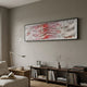 Fluenta Scarlet Red Ripple Linear Cardboard 3D Wall Art by Giant Sculptures mounted horizontally above a wooden console with books, lamp, and vase in a modern living room.