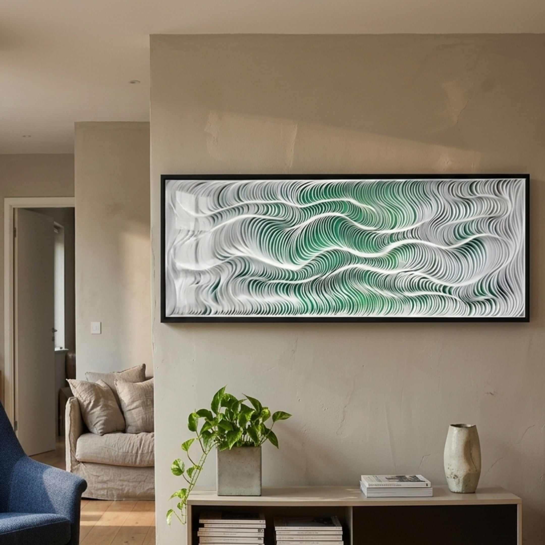 Fluenta Green Ripple Linear Cardboard 3D Wall Art by Giant Sculptures, framed in black above a console with a pothos plant in a modern living room.