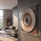 Oculis Rustic Warmth Square Handmade 3D Paper Wall Art by Giant Sculptures mounted on a dark grey wall in a modern living room with a grey sofa and bookshelf.