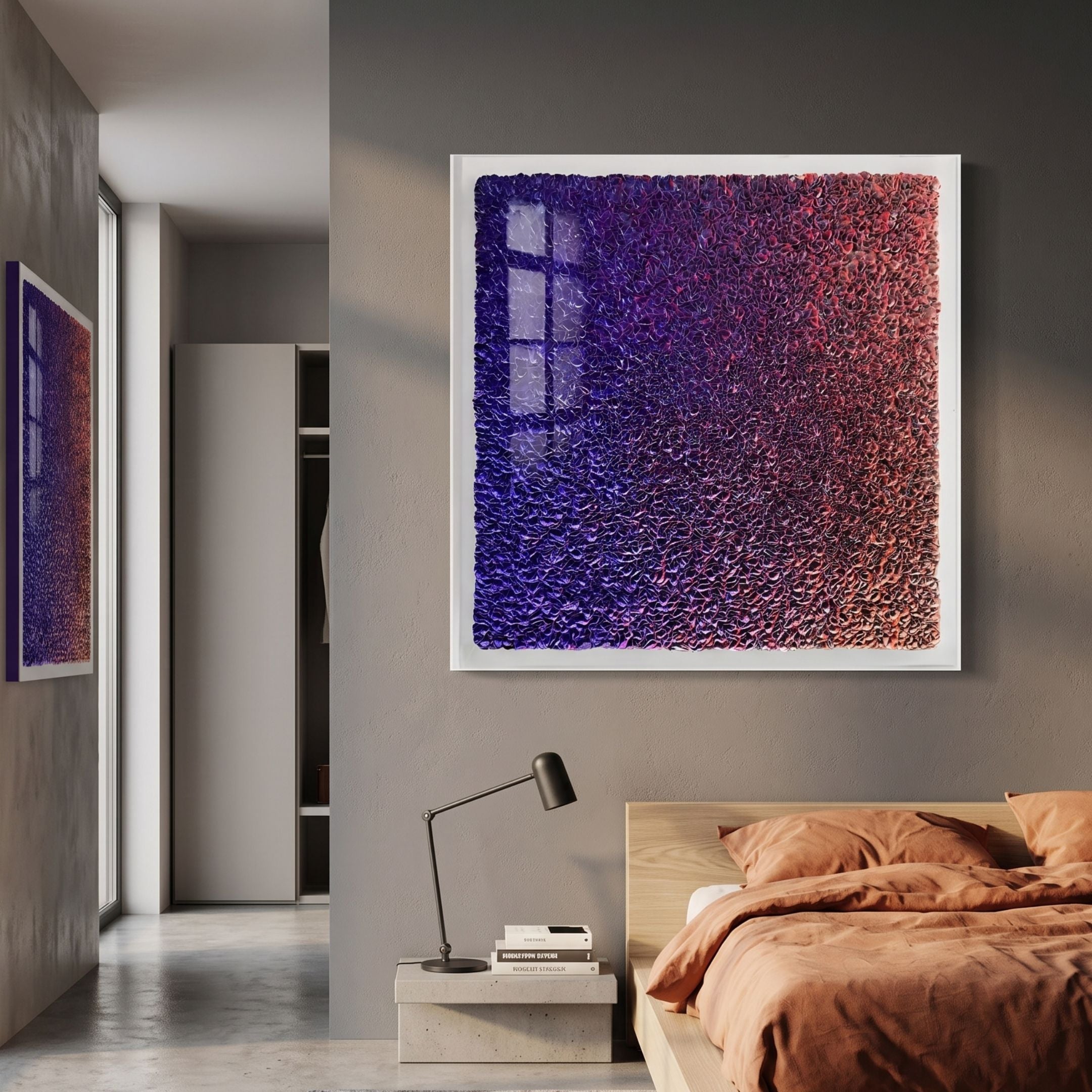Chromatica Square 3D Wall Art by Giant Sculptures, folded paper in purple-to-red gradient, displayed above a bedside table in a modern bedroom with terracotta bedding.