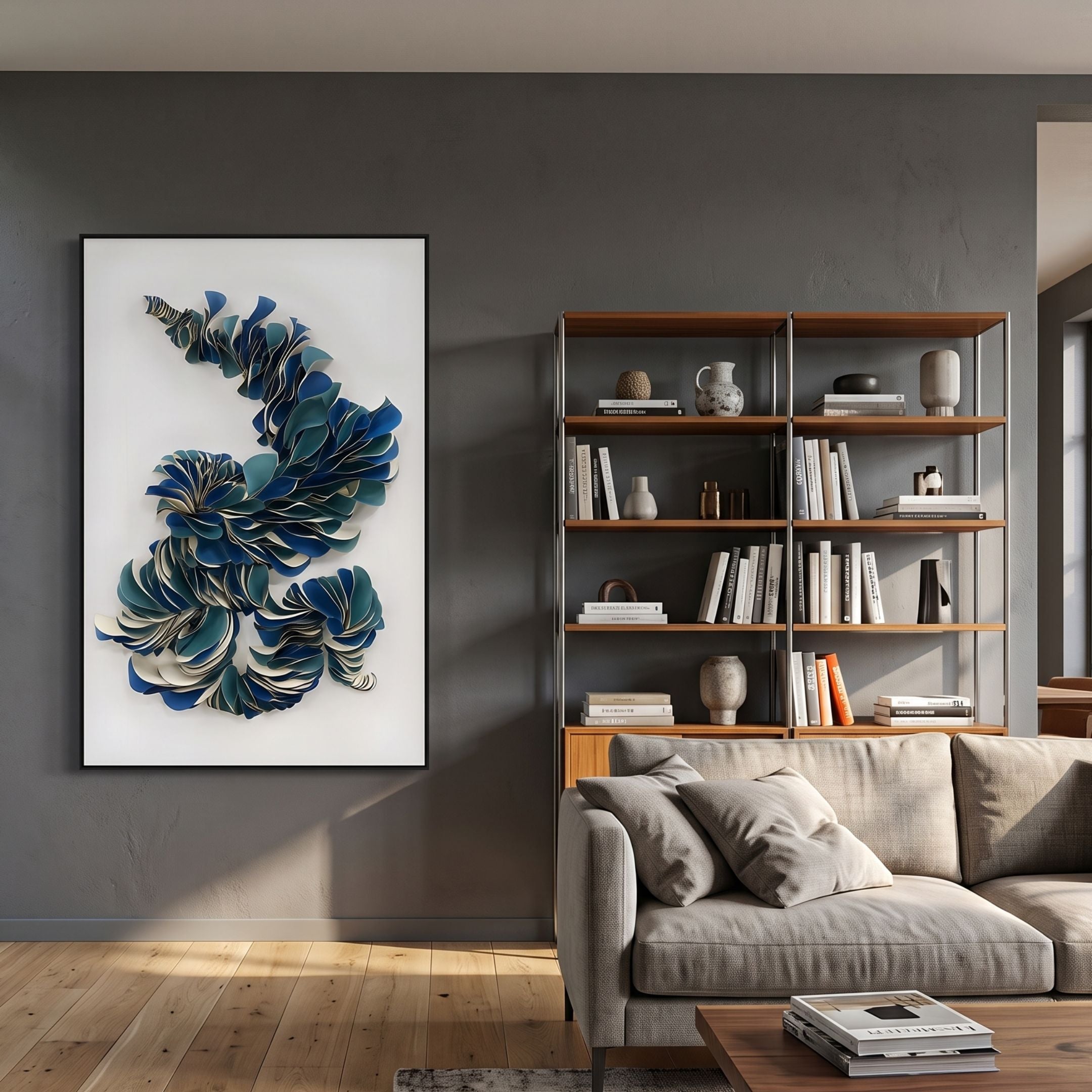 Aeriform Blue Whirl Leather Abstract Wall Art by Giant Sculptures, framed in black above a grey sofa and wooden bookshelf in a modern living room.