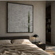Tracery V Green & White Textured Paper Wall Art by Giant Sculptures mounted above a bed with beige linens, dark nightstand, and black dome lamp.