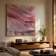 Terrane Graceful Pink Layered Abstract Wall Art by Giant Sculptures in a gold frame above a wooden console with a Marshall speaker and olive branches.