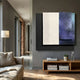 Astra Galaxy Blue Textured Wood Carving 3D Wall Art mounted above a wooden console in a modern living room with grey walls, linen sofa, and floor lamp.