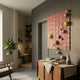 Orbison Peach 3D Wood Relief Wall Art by Giant Sculptures, peach wave-carved panel with yellow and blush spheres, mounted in a hallway above a wood sideboard.