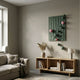 Orbison Sage Green 3D Wood Relief Wall Art with floating green and pink metal balls displayed above an oak console in a neutral modern living room.