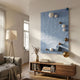 Orbison Sky Blue 3D Wood Relief Wall Art with white, gold, and blue metal balls, displayed above a wooden console in a sunlit living room.