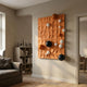 Orbison Terracotta 3D Wood Relief Wall Art with glossy blue, orange, and white metal spheres, mounted in a neutral living room beside a bookshelf and sofa.