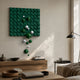 Orbina Green 3D Wood Relief Wall Art by Giant Sculptures, featuring a green geometric grid panel with glossy green and white spheres cascading diagonally, mounted above a wooden sideboard in a sunlit living room.