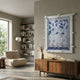 Florere Misty Blue Hand-Painted Sandstone 3D Wall Art by Giant Sculptures displayed above a walnut sideboard in a Nordic living room with bookshelves and a beige lounge chair.
