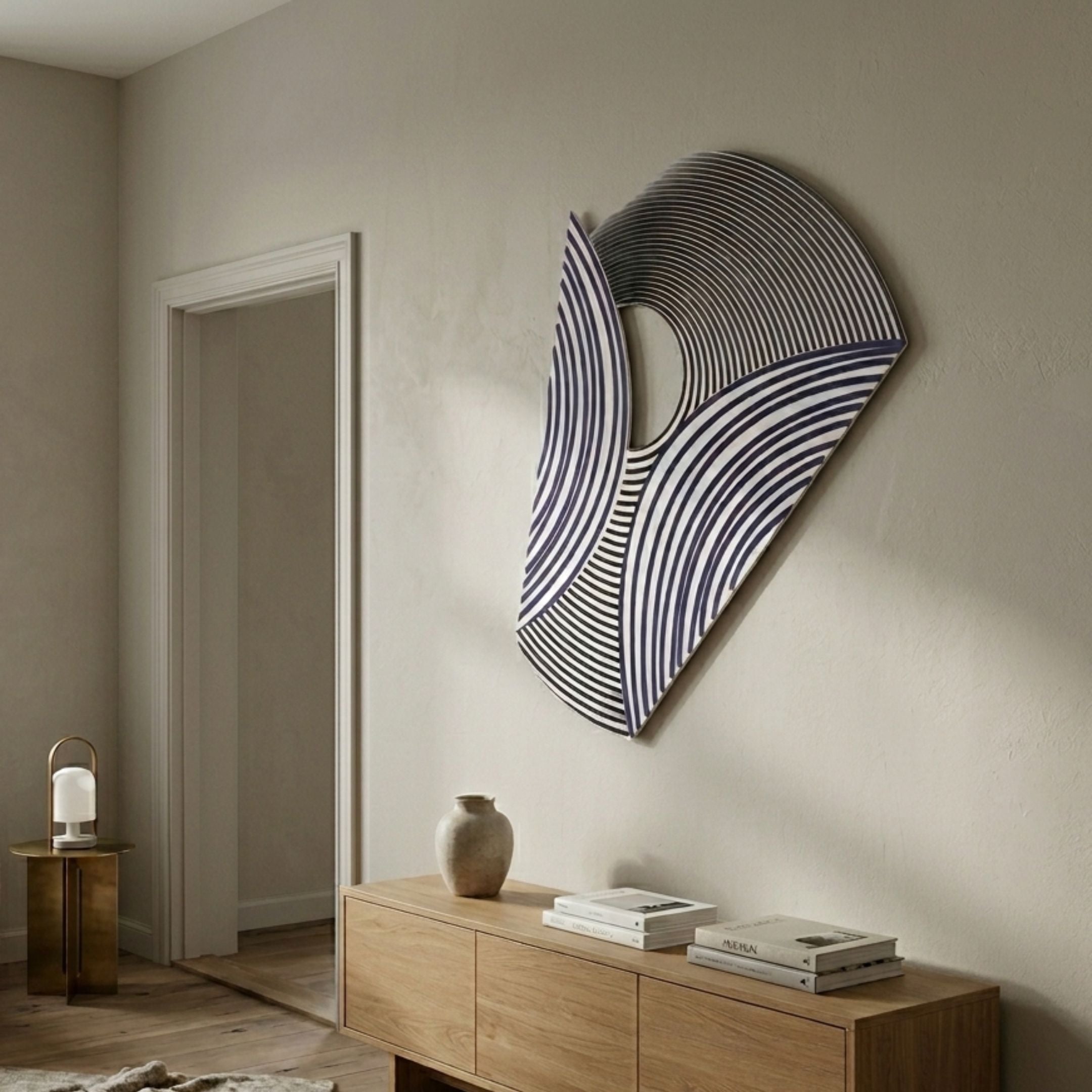 Orison Monochrome Fusion UV 3D Wood Wall Art by Giant Sculptures with curved navy and black linework on a fan-shaped panel, displayed above an oak sideboard in a hallway.