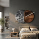 Lunaris Grey Marble & Bronze LED Wall Art by Giant Sculptures mounted above a beige bed, pairing veined grey marble and bronze discs with a white gold-tipped rod.