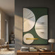 Opus Green & Gold Accent Circular Geometric Leather 3D Wall Art mounted above a wood console with books in a modern hallway beside a woven lounge chair.