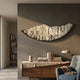 Arcana Beige Woodland Mosaic Half-Moon 3D Wall Art by Giant Sculptures mounted above a walnut sideboard with books, lamp, and vase in a modern living room.