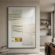 Opus White & Gold Accent Layered Geometric Leather 3D Wall Art by Giant Sculptures, black-framed and mounted in a neutral modern living room with shelving.