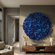 Eclat Sphere Blue Abstract Metal Wall Art by Giant Sculptures displayed above a walnut console with pampas grass and lamp in a modern living room.