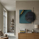 Tesselle Blue Metal Fold & Grey Textured Geometric Wall Art by Giant Sculptures displayed in a modern living room above a wooden sideboard with books and lamp.