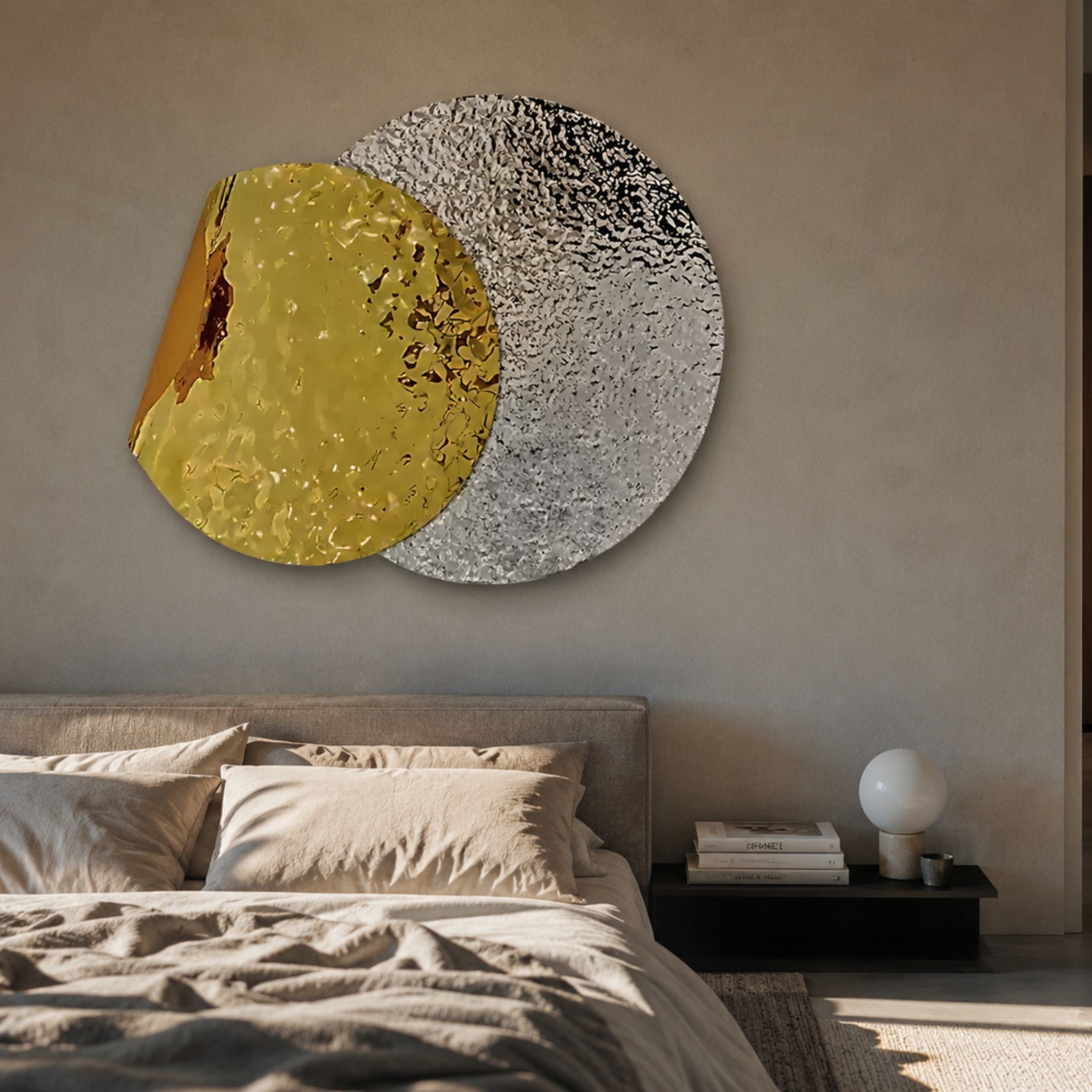 Metaluxe I Gold & Silver Dual Disc Textured 3D Wall Art mounted above an upholstered bed with linen bedding and a dark bedside shelf.