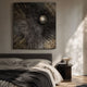 Astralis Bronze Cosmic Drift Abstract 3D Wall Art by Giant Sculptures, textured bronze panel with polished silver sphere, mounted above a dark bedroom headboard.